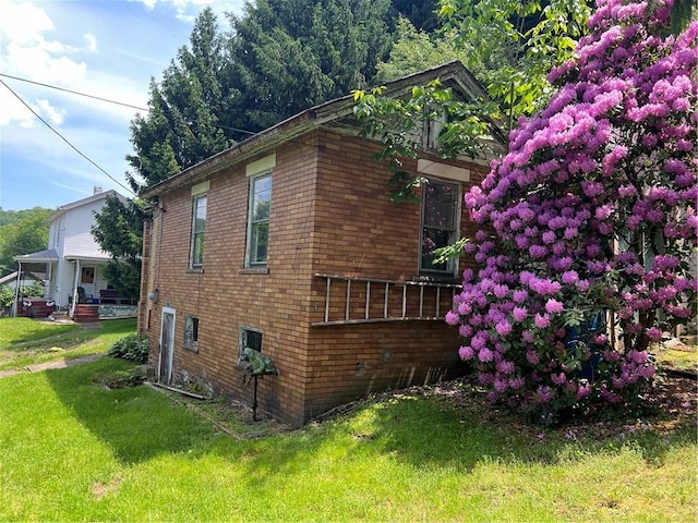 view of home's exterior featuring a lawn