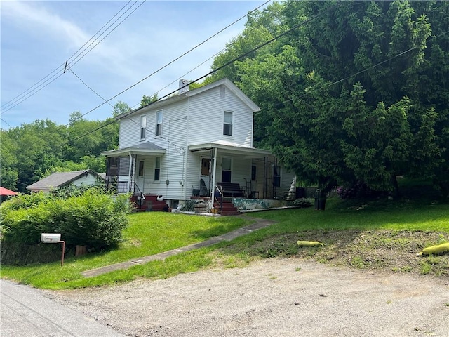 view of front facade featuring a porch and a front yard