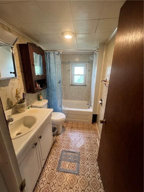 full bathroom with tile patterned floors, toilet, crown molding, vanity, and shower / bath combo