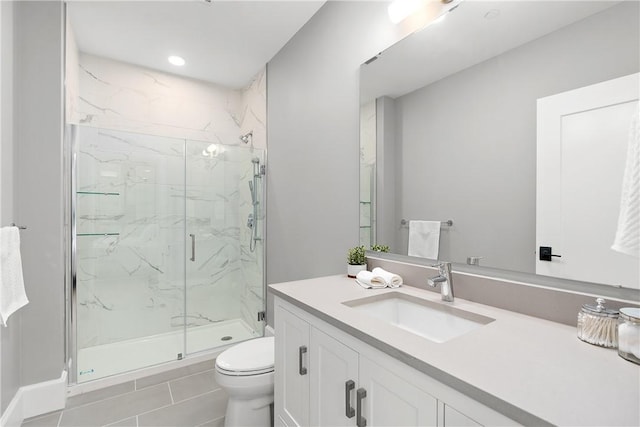 full bath featuring vanity, recessed lighting, a marble finish shower, and toilet