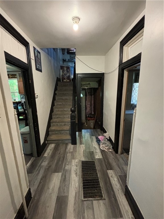 corridor with wood-type flooring