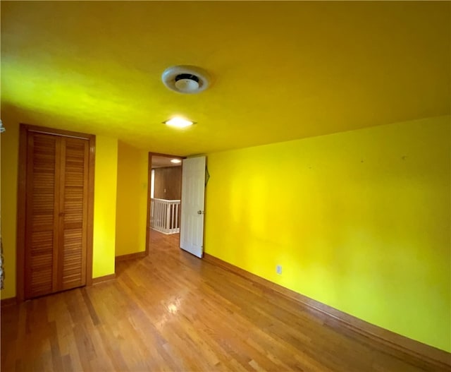 spare room with hardwood / wood-style floors