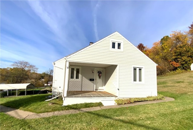 rear view of property with a lawn