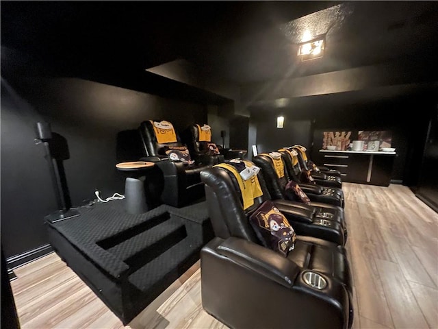 home theater room featuring light hardwood / wood-style floors