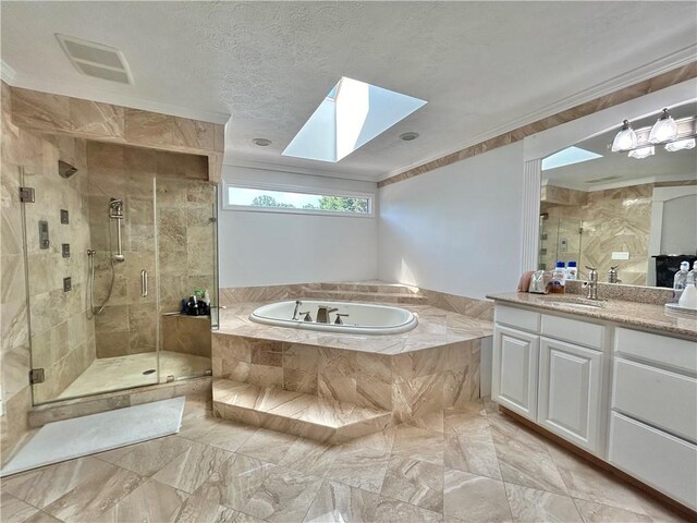 bathroom with crown molding, independent shower and bath, tile floors, a skylight, and vanity