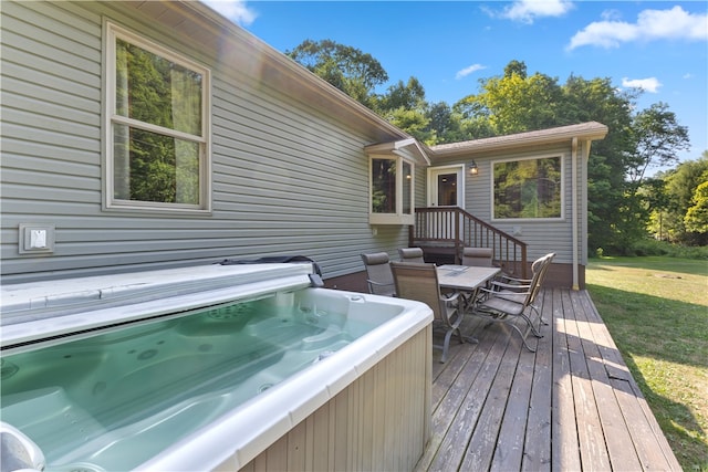 wooden terrace featuring a hot tub