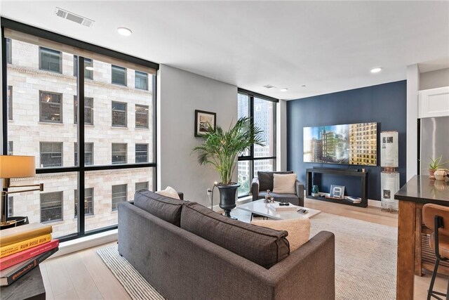 350 Oliver Ave Unit 908, Downtown Pgh, PA 15222 - living area featuring light wood finished floors, recessed lighting, visible vents, and expansive windows