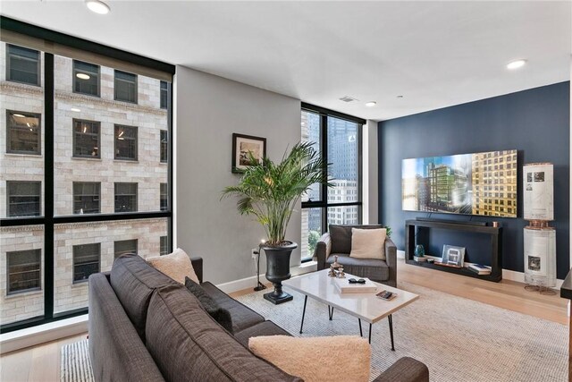 350 Oliver Ave Unit 908, Downtown Pgh, PA 15222 - living area with recessed lighting, wood finished floors, baseboards, and floor to ceiling windows