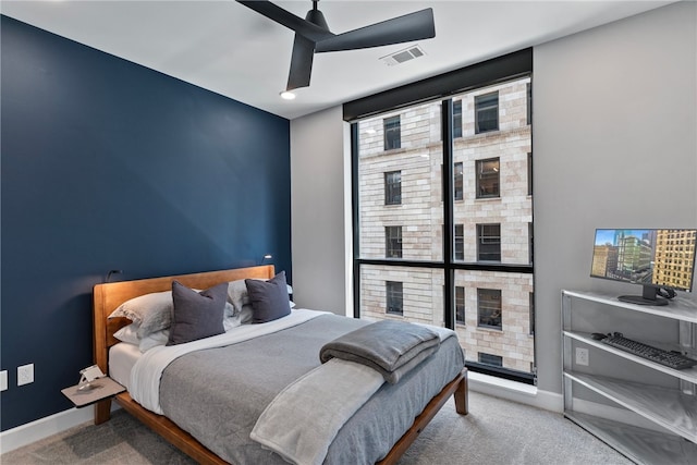 carpeted bedroom with ceiling fan