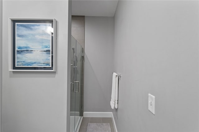 interior space featuring tile flooring and an enclosed shower