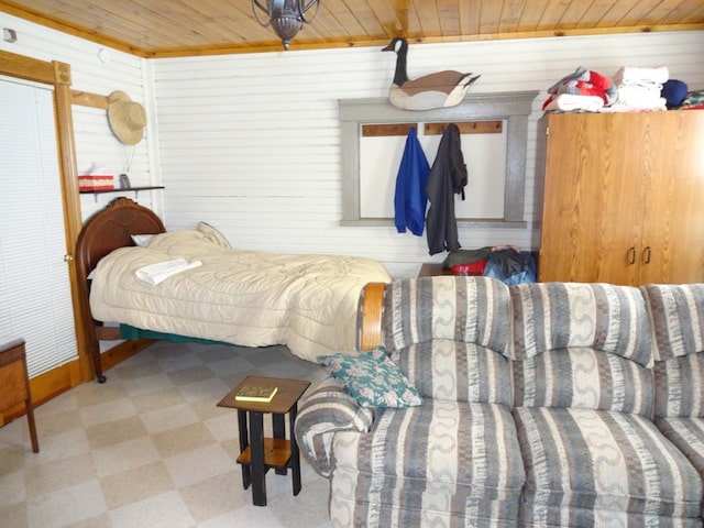 bedroom featuring wooden ceiling and tile flooring