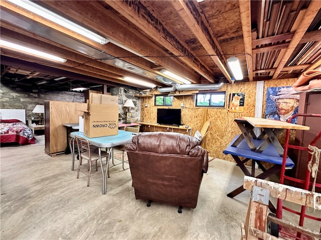 living room featuring concrete flooring