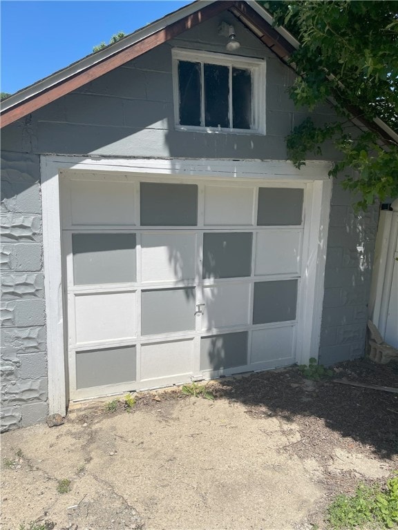 exterior space with a garage and an outdoor structure