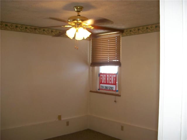 spare room featuring ceiling fan