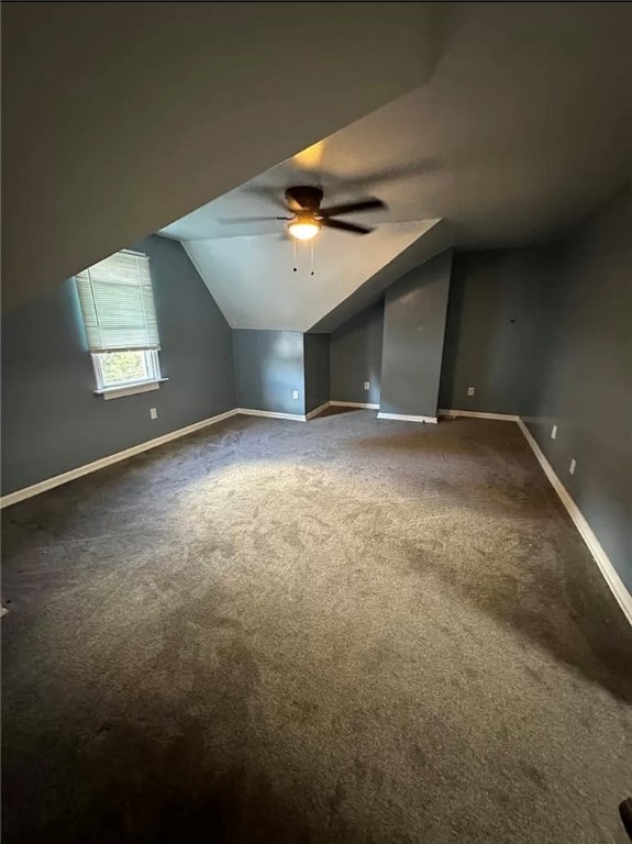 bonus room with ceiling fan, carpet floors, and lofted ceiling