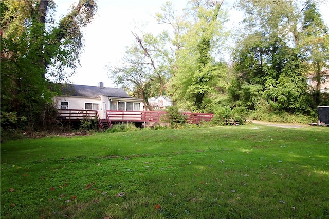 view of yard featuring a wooden deck