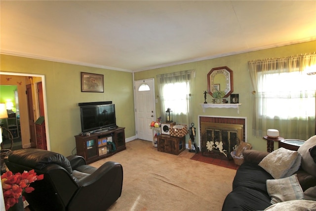 carpeted living room with a brick fireplace and crown molding