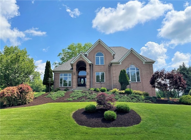 front facade with a front yard