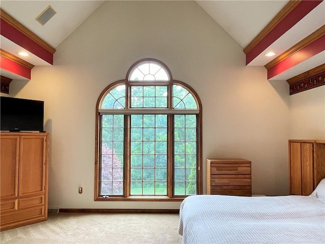 carpeted bedroom featuring high vaulted ceiling