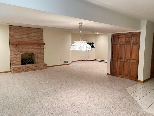 unfurnished living room with light colored carpet, a fireplace, and a baseboard radiator