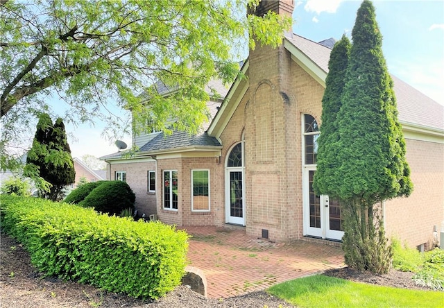 rear view of house featuring a patio