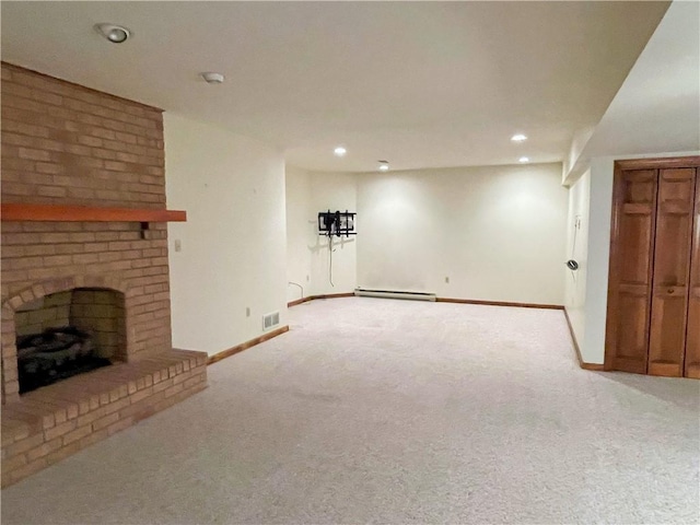 basement with light carpet, a brick fireplace, and baseboard heating