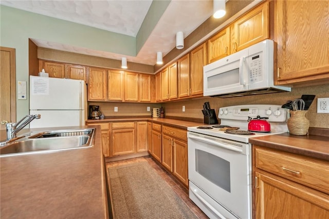 kitchen with sink and white appliances