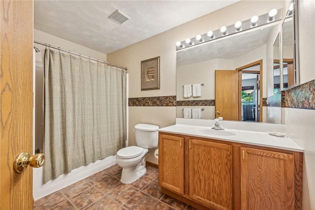 full bathroom featuring toilet, shower / tub combo, vanity, and tile walls