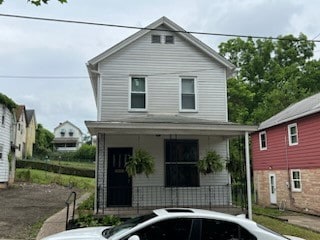 view of property with covered porch