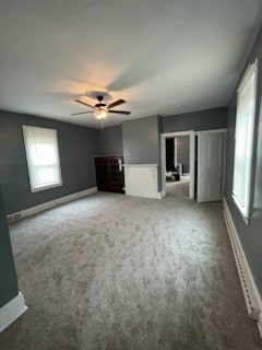 unfurnished room with carpet flooring and ceiling fan