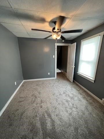 unfurnished bedroom with ceiling fan and carpet floors