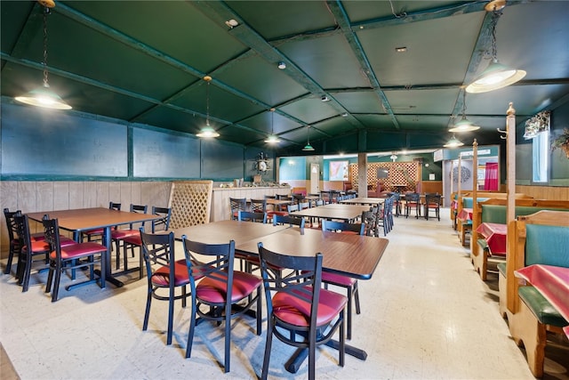 dining room with lofted ceiling