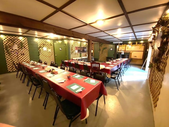 dining space featuring concrete floors