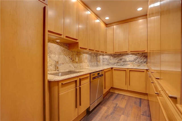 kitchen with dark wood-type flooring, light brown cabinetry, sink, stainless steel dishwasher, and light stone countertops