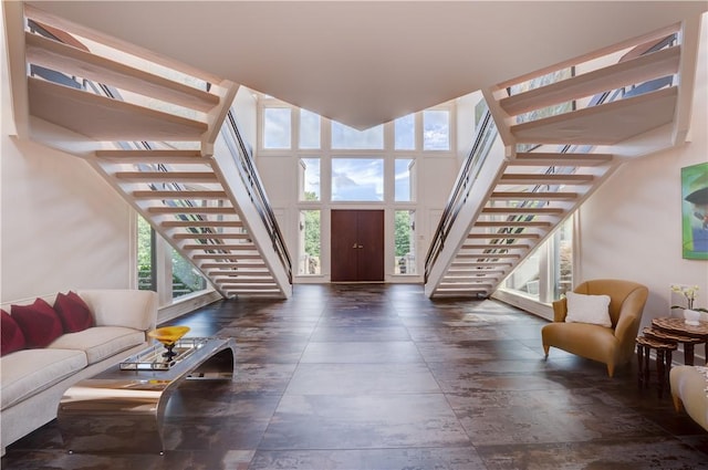 foyer featuring a towering ceiling