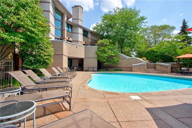 view of swimming pool featuring a patio