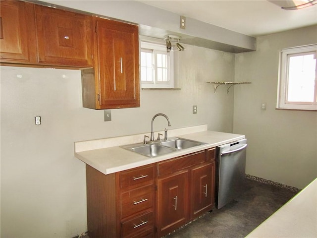 kitchen with a wealth of natural light, dishwasher, and sink