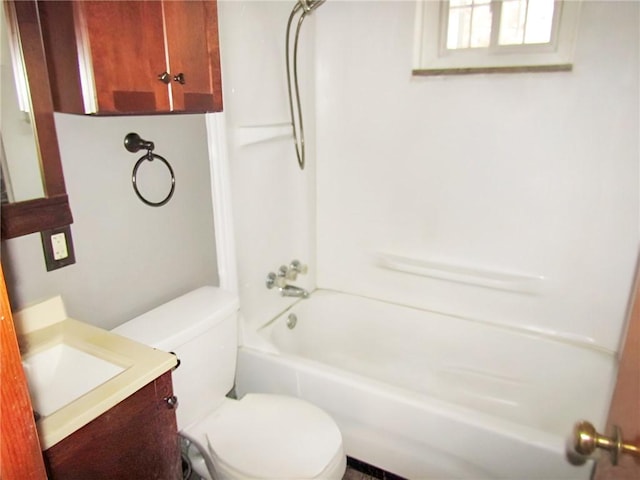 full bathroom featuring toilet, vanity, and bathing tub / shower combination