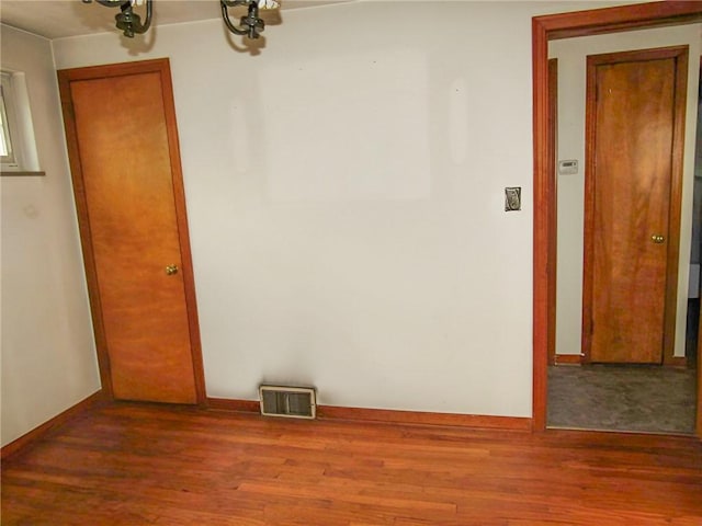 spare room featuring hardwood / wood-style floors