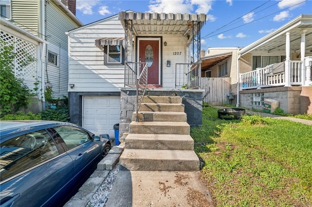 view of front of property featuring a garage