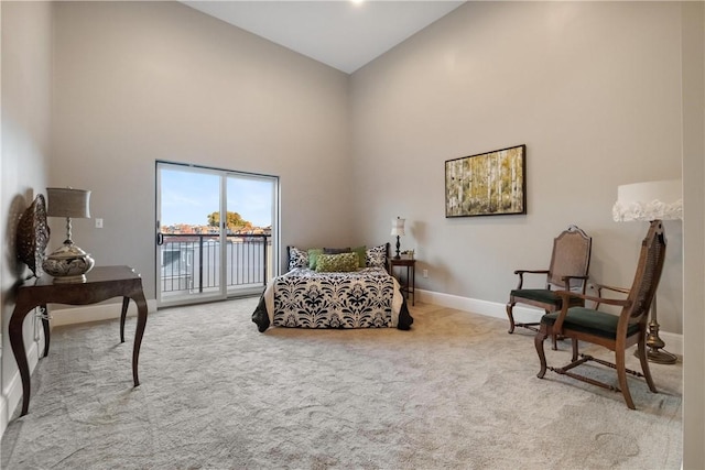 sitting room featuring light carpet and high vaulted ceiling