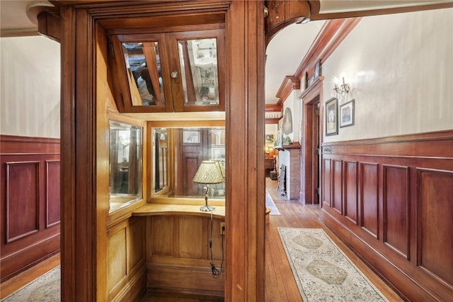 room details with crown molding and hardwood / wood-style floors