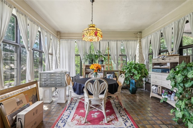 sunroom / solarium featuring a healthy amount of sunlight