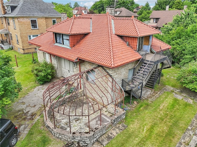 back of property featuring a yard