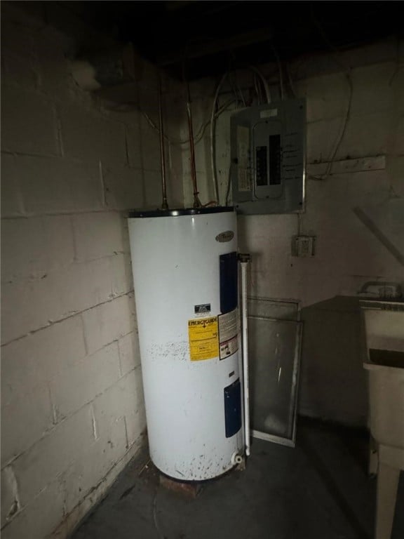 utility room featuring electric water heater