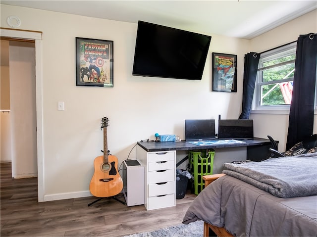 bedroom with hardwood / wood-style floors