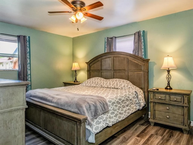 bedroom featuring ceiling fan and dark hardwood / wood-style flooring