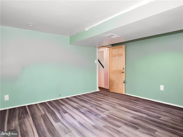 unfurnished room with hardwood / wood-style flooring