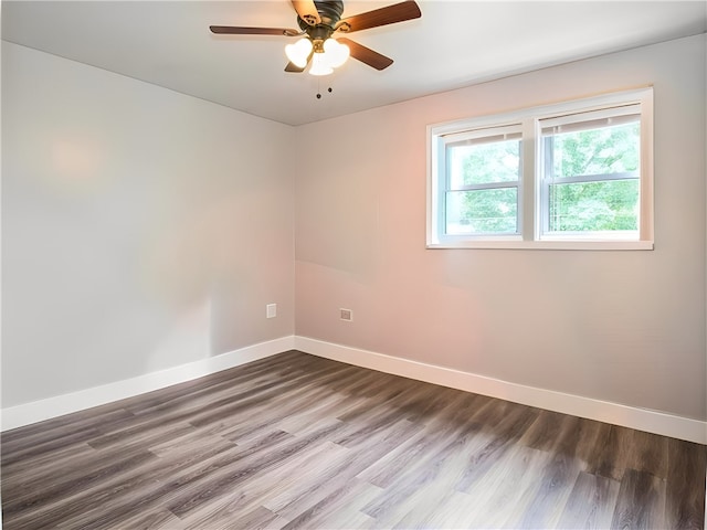 empty room featuring ceiling fan and hardwood / wood-style floors