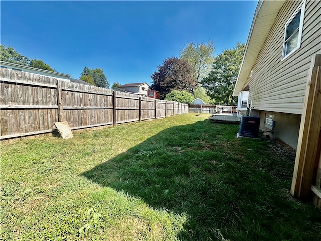 view of yard featuring central air condition unit